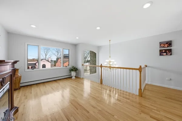 a view of a room with furniture wooden floor and window