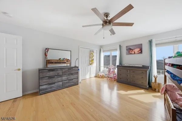 a room with furniture and wooden floor