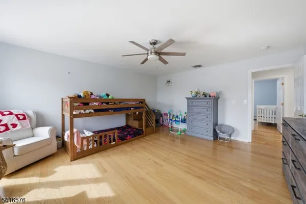 a bedroom with furniture and a chandelier