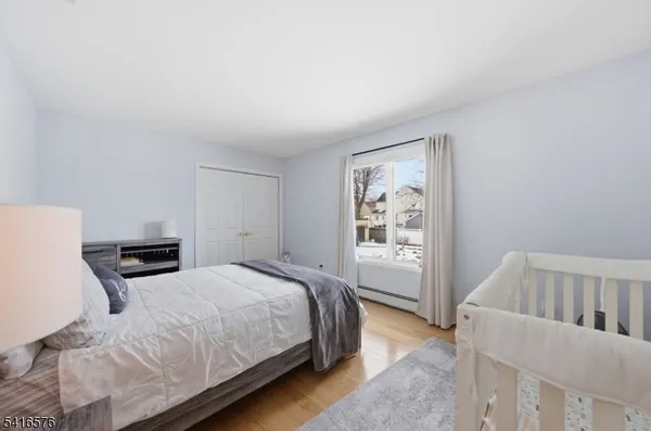 a bedroom with a bed next to a window