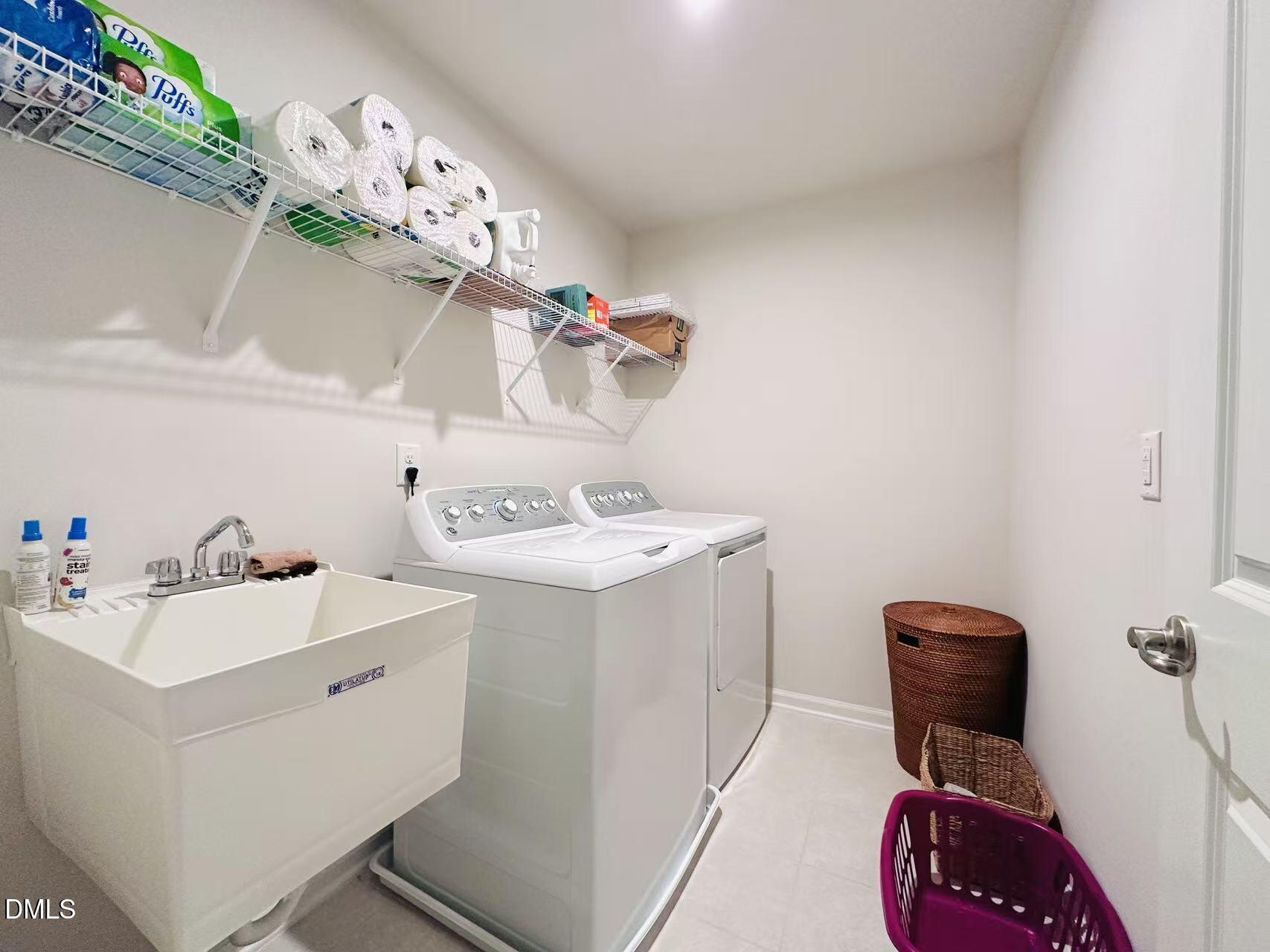4740 Randall Road Durham, NC 27707 - Photo 16 of 29 a utility room with dryer and washer