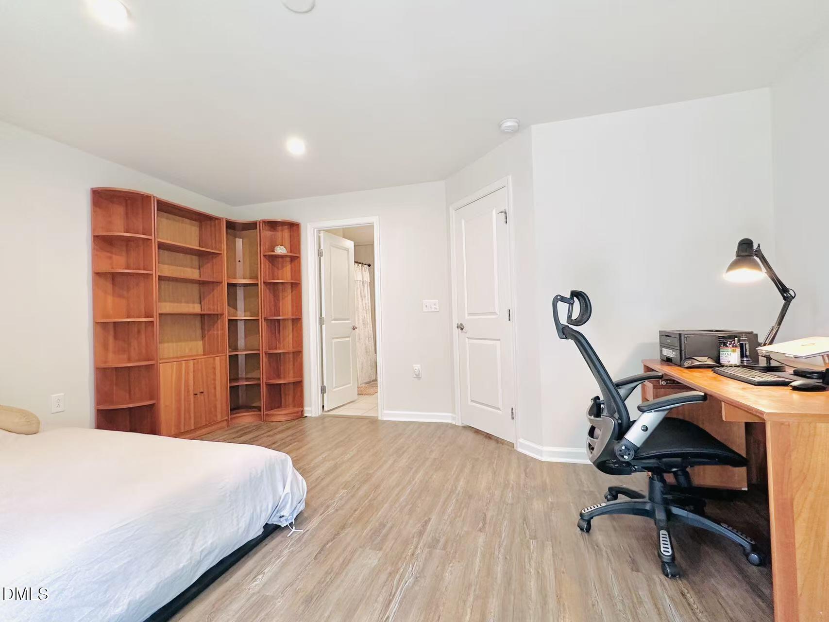 4740 Randall Road Durham, NC 27707 - Photo 19 of 29 a view of a workspace with furniture and a window