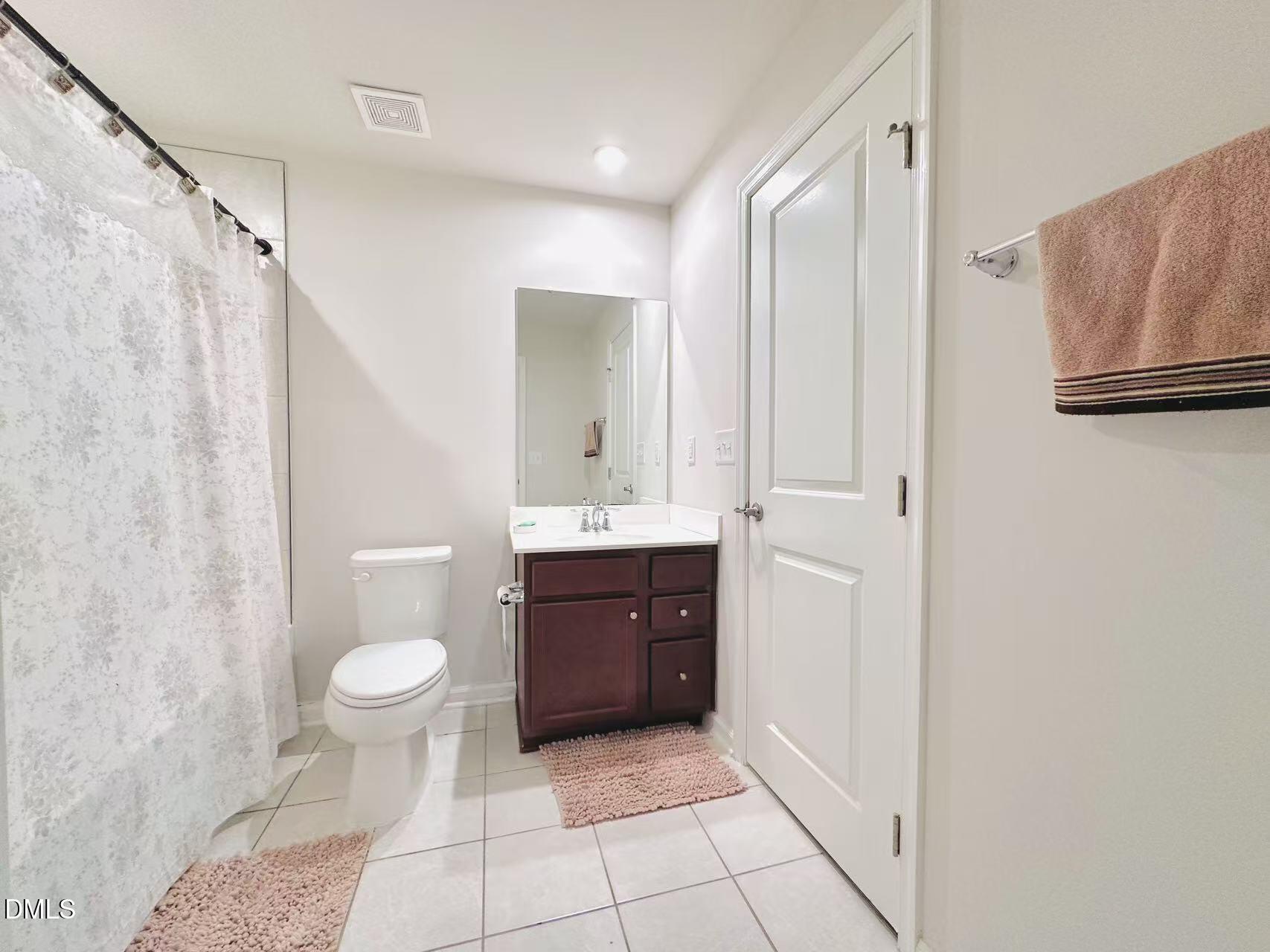 4740 Randall Road Durham, NC 27707 - Photo 20 of 29 a bathroom with a sink toilet and shower