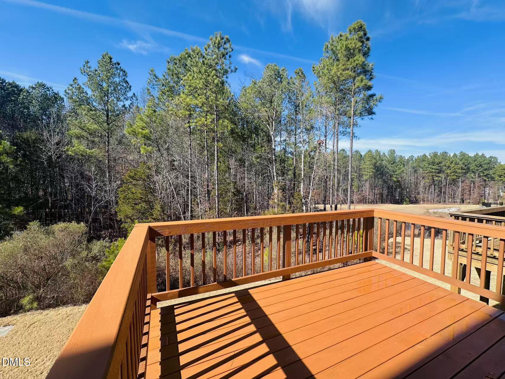 4740 Randall Road Durham, NC 27707 - Photo 24 of 29 a view of balcony with wooden floor and fence