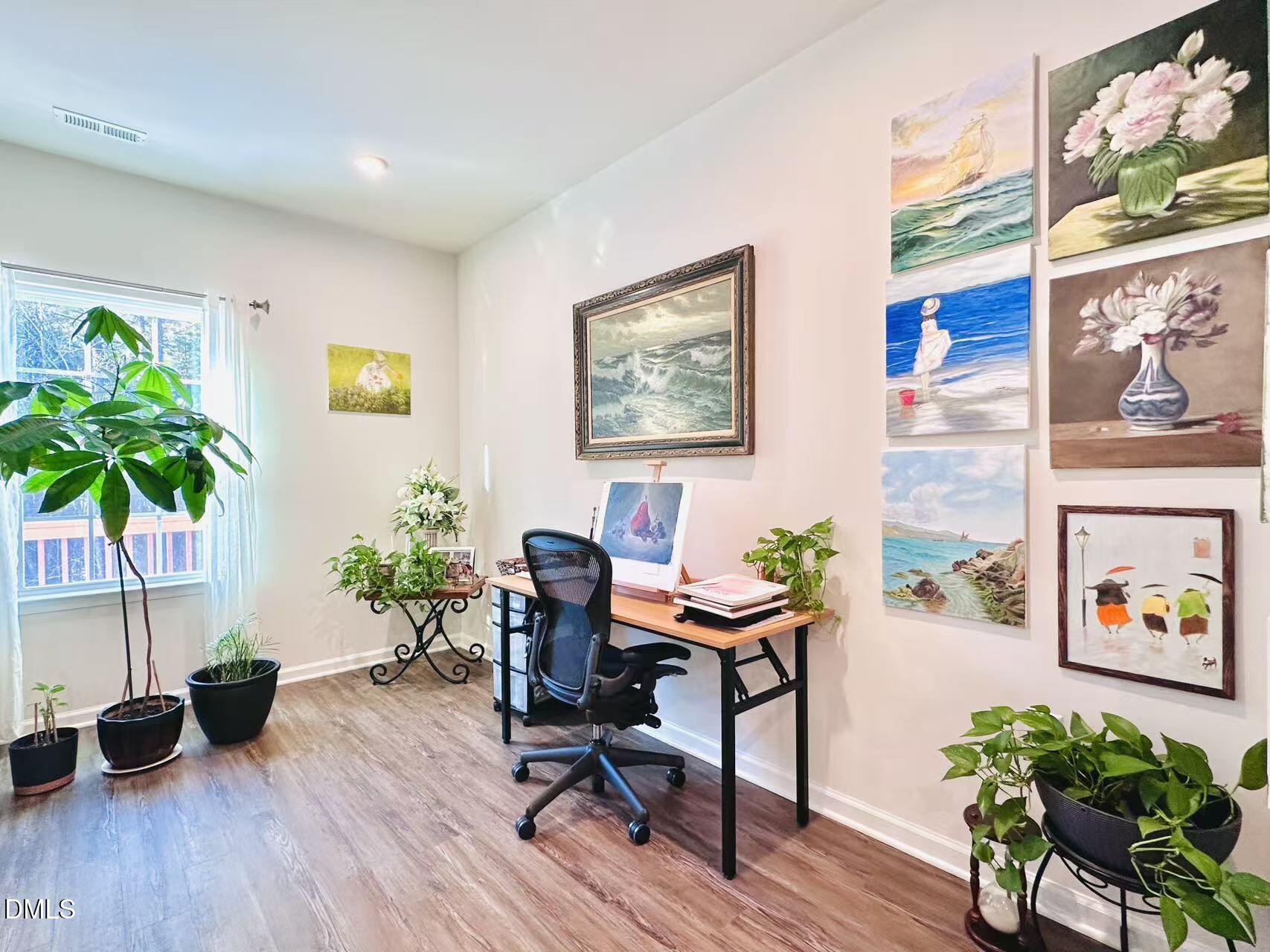 4740 Randall Road Durham, NC 27707 - Photo 7 of 29 a workspace with furniture and a potted plant