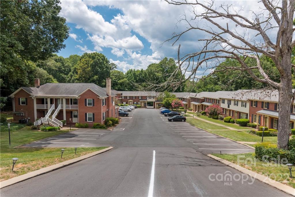 623 South New Hope Road, Unit 21 Gastonia, NC 28054 - Photo 1 of 18 a view of a house with backyard and sitting area