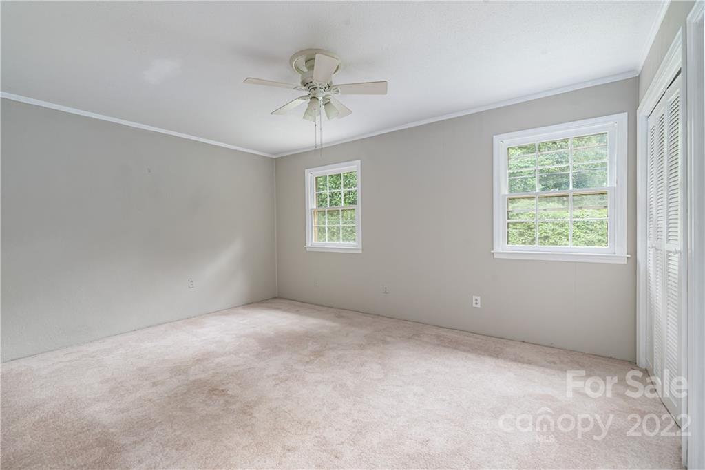 623 South New Hope Road, Unit 21 Gastonia, NC 28054 - Photo 13 of 18 an empty room with windows and fan