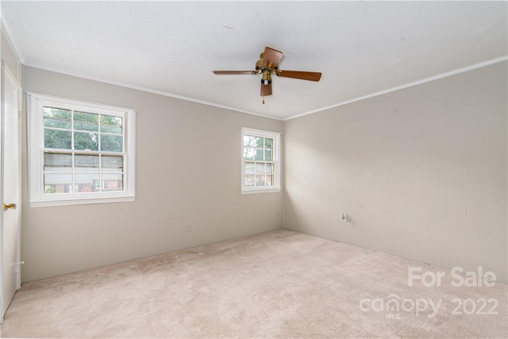 623 South New Hope Road, Unit 21 Gastonia, NC 28054 - Photo 16 of 18 an empty room with windows