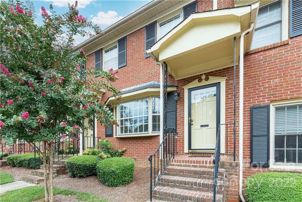 623 South New Hope Road, Unit 21 Gastonia, NC 28054 - Photo 3 of 18 a front view of a house with a yard