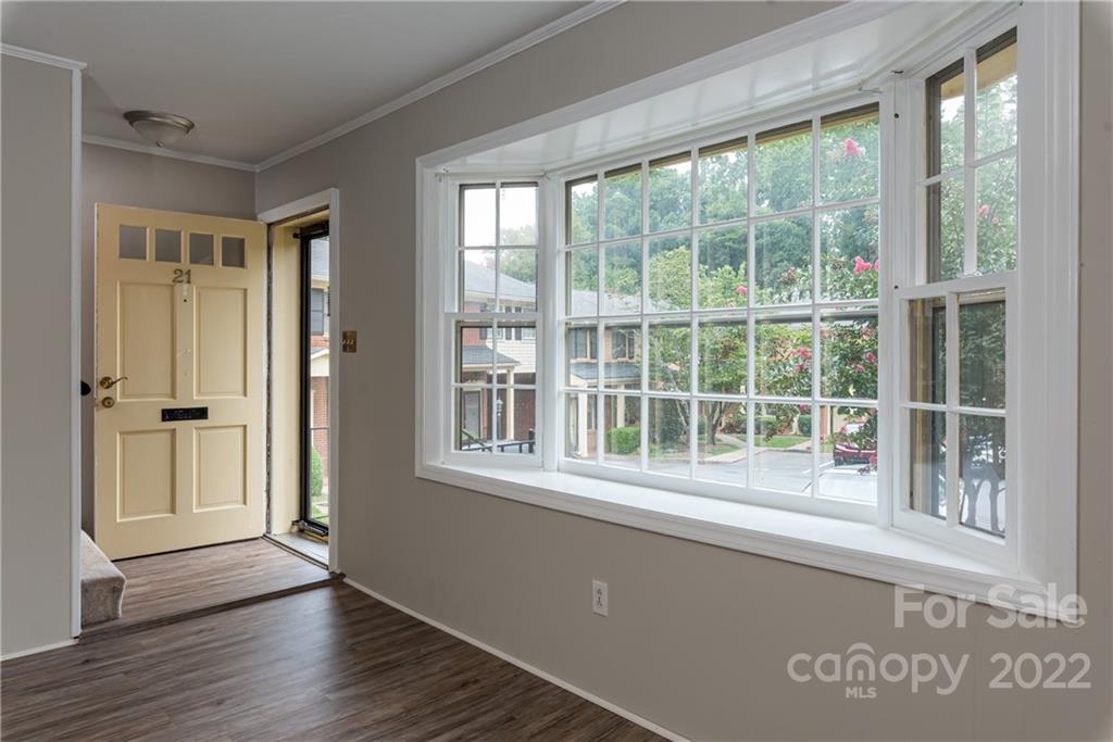 623 South New Hope Road, Unit 21 Gastonia, NC 28054 - Photo 4 of 18 a view of empty room with wooden floor and windows