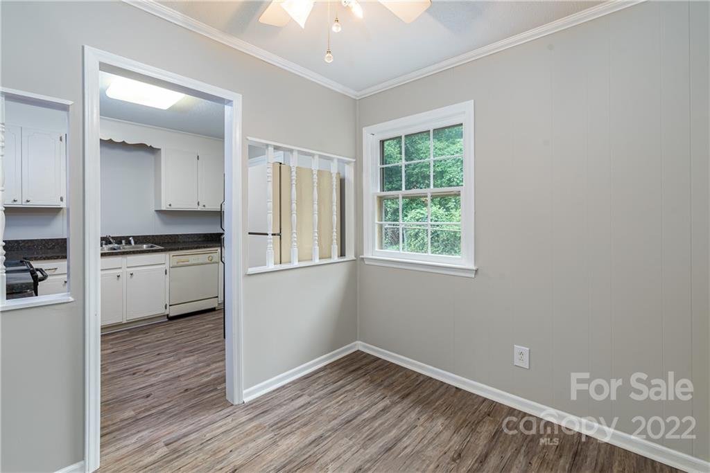 623 South New Hope Road, Unit 21 Gastonia, NC 28054 - Photo 6 of 18 a kitchen with a refrigerator and white cabinets