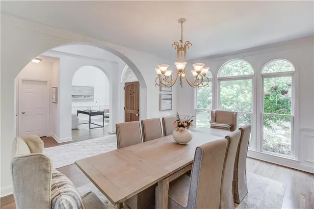 a large kitchen with stainless steel appliances granite countertop a lot of counter space and a sink
