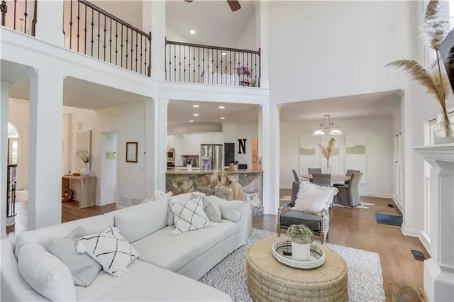 a large bathroom with a double vanity sink a large mirror a shower and a bathtub