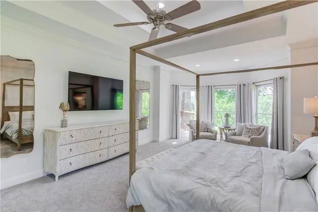 a bedroom with a bed and a dresser in it