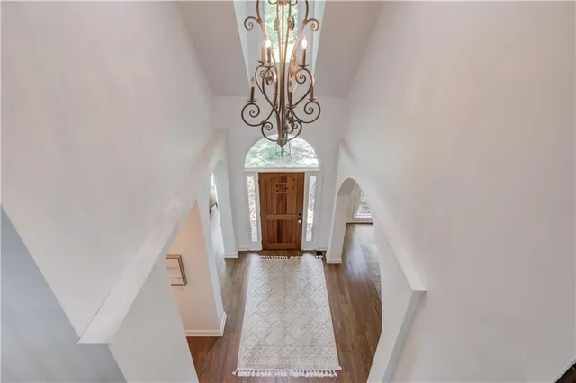 a room with pool table and windows