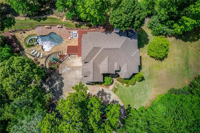 an aerial view of a house with outdoor space and street view