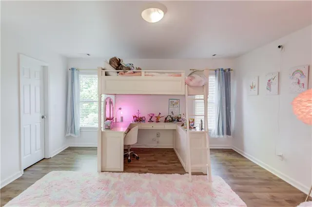 a view of a tree in a yard next to a building