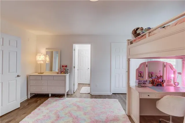 a view of a garden with a building in the background