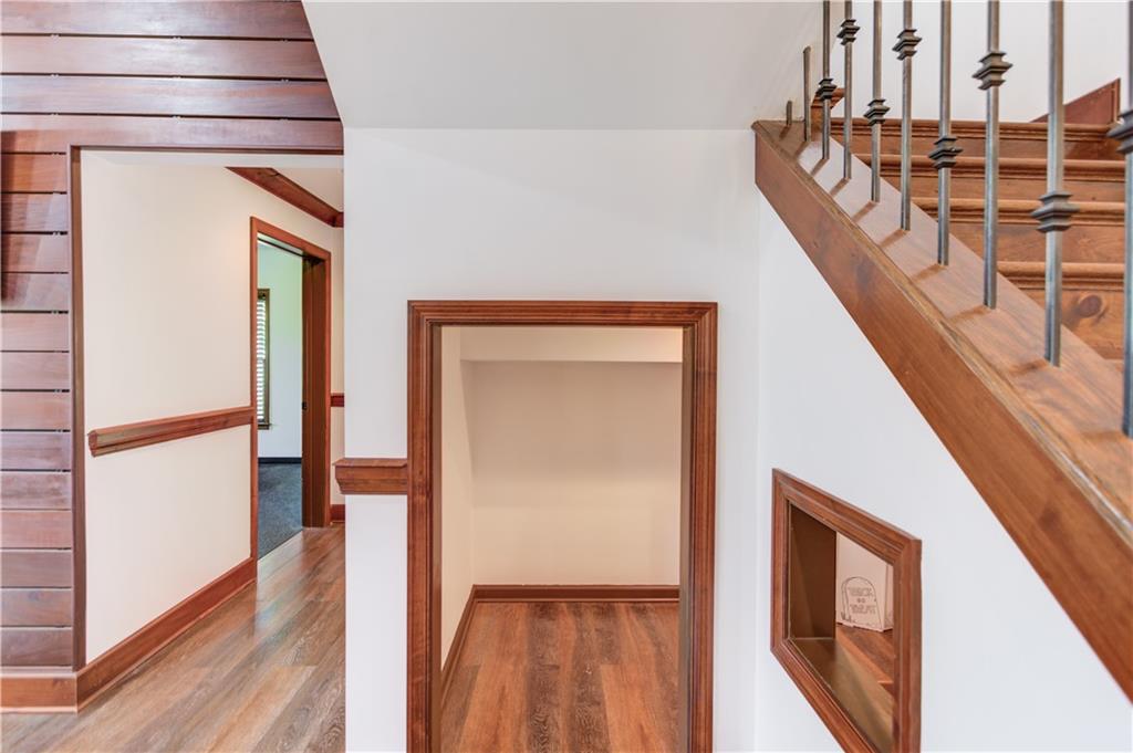 2870 Roanoke Road Cumming, GA 30041 - Photo 76 of 94 a view of a hallway with wooden floor and staircase