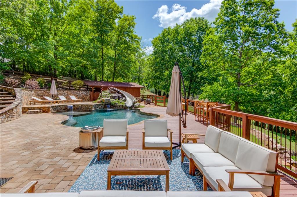 2870 Roanoke Road Cumming, GA 30041 - Photo 91 of 94 a view of a patio with couches chairs and a table and chairs with wooden fence