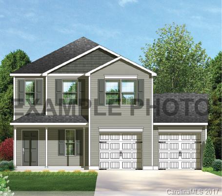 2132 Gunnars Ridge Road, Unit 43 Lancaster, SC 29720 - Photo 1 of 24 a front view of a house with a yard and glass windows