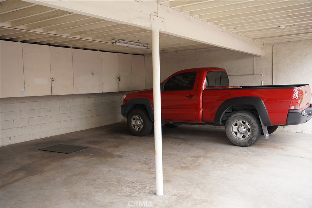 300 Bethany Road, Unit G Burbank, CA 91504 - Photo 4 of 9 a view of a garage and car parked