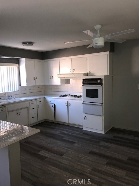 300 Bethany Road, Unit G Burbank, CA 91504 - Photo 5 of 9 a kitchen with granite countertop a sink stainless steel appliances and cabinets