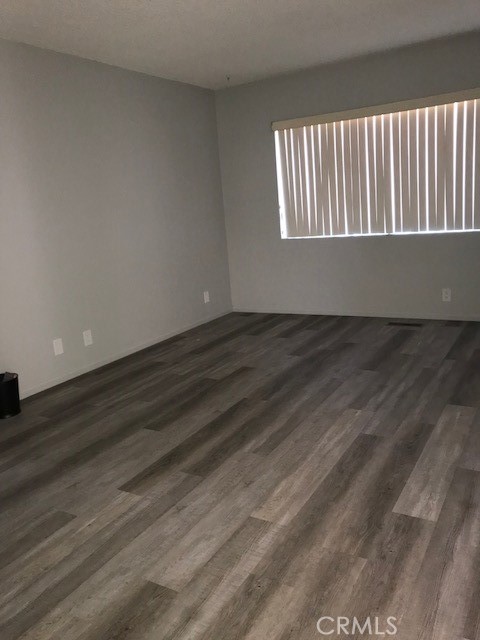300 Bethany Road, Unit G Burbank, CA 91504 - Photo 6 of 9 a view of wooden floor and window in a room