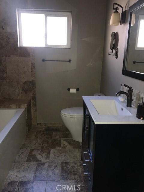 300 Bethany Road, Unit G Burbank, CA 91504 - Photo 7 of 9 a bathroom with a sink and mirror