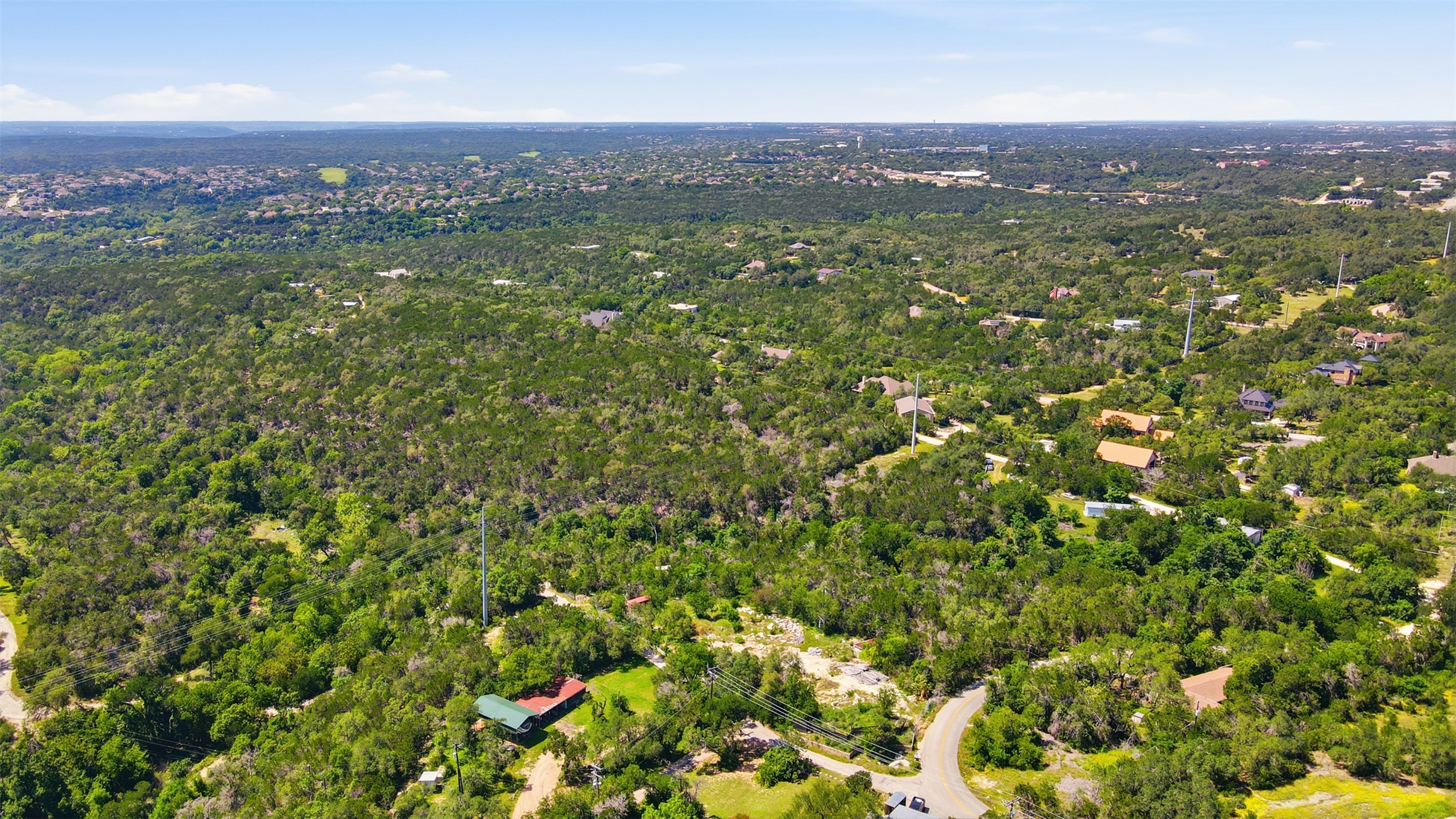 0 North Ranch Road 620 Road Austin, TX 78726 - Photo 15 of 20 an aerial view of residential houses with outdoor space and trees