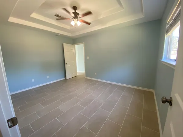 an empty room with a bathroom