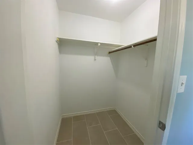 a view of an empty walk in closet