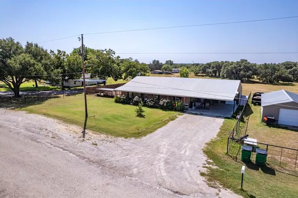 a view of a swimming pool with a yard