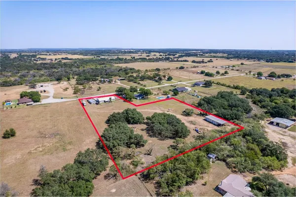 an aerial view of residential houses and outdoor space