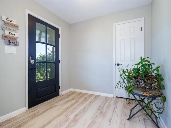 a room with window and flower pot