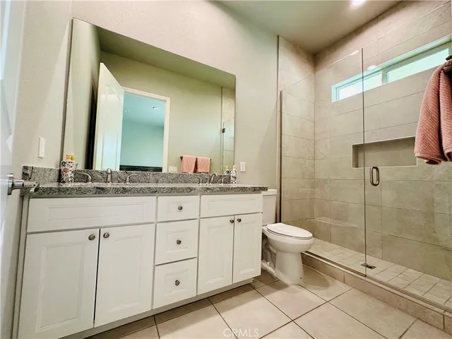 a bathroom with a toilet sink and a mirror