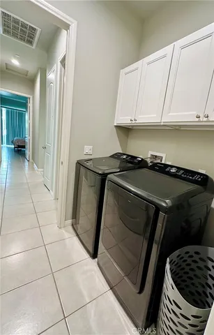 a kitchen with a stove a microwave and cabinets
