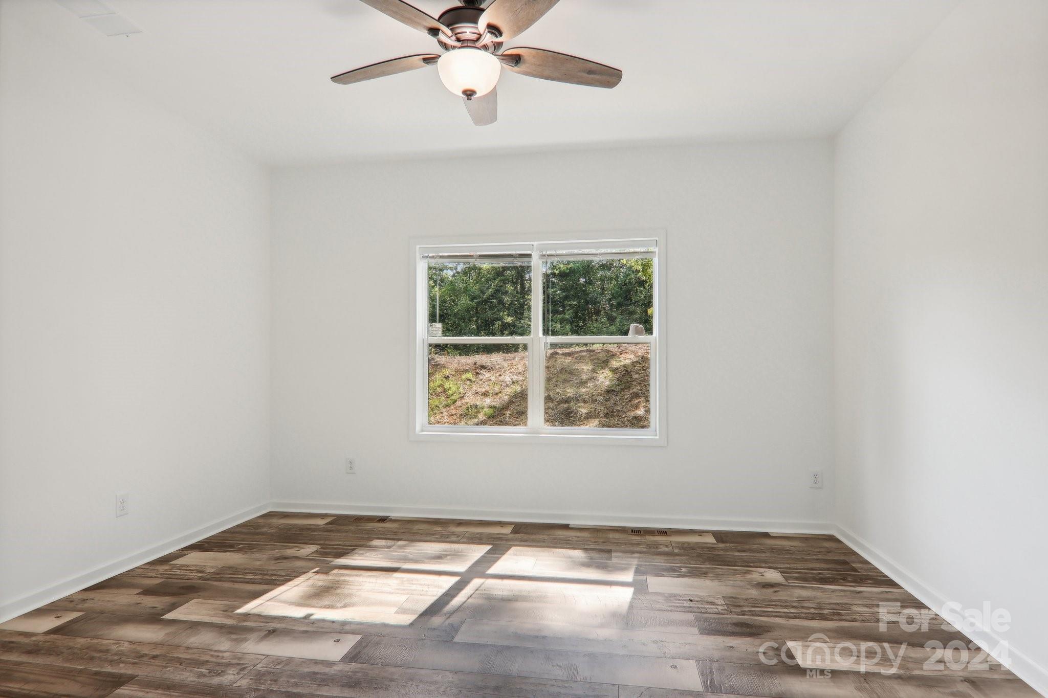 1730 Windswept Ridge Road Marshall, NC 28753 - Photo 20 of 45 an empty room with a window