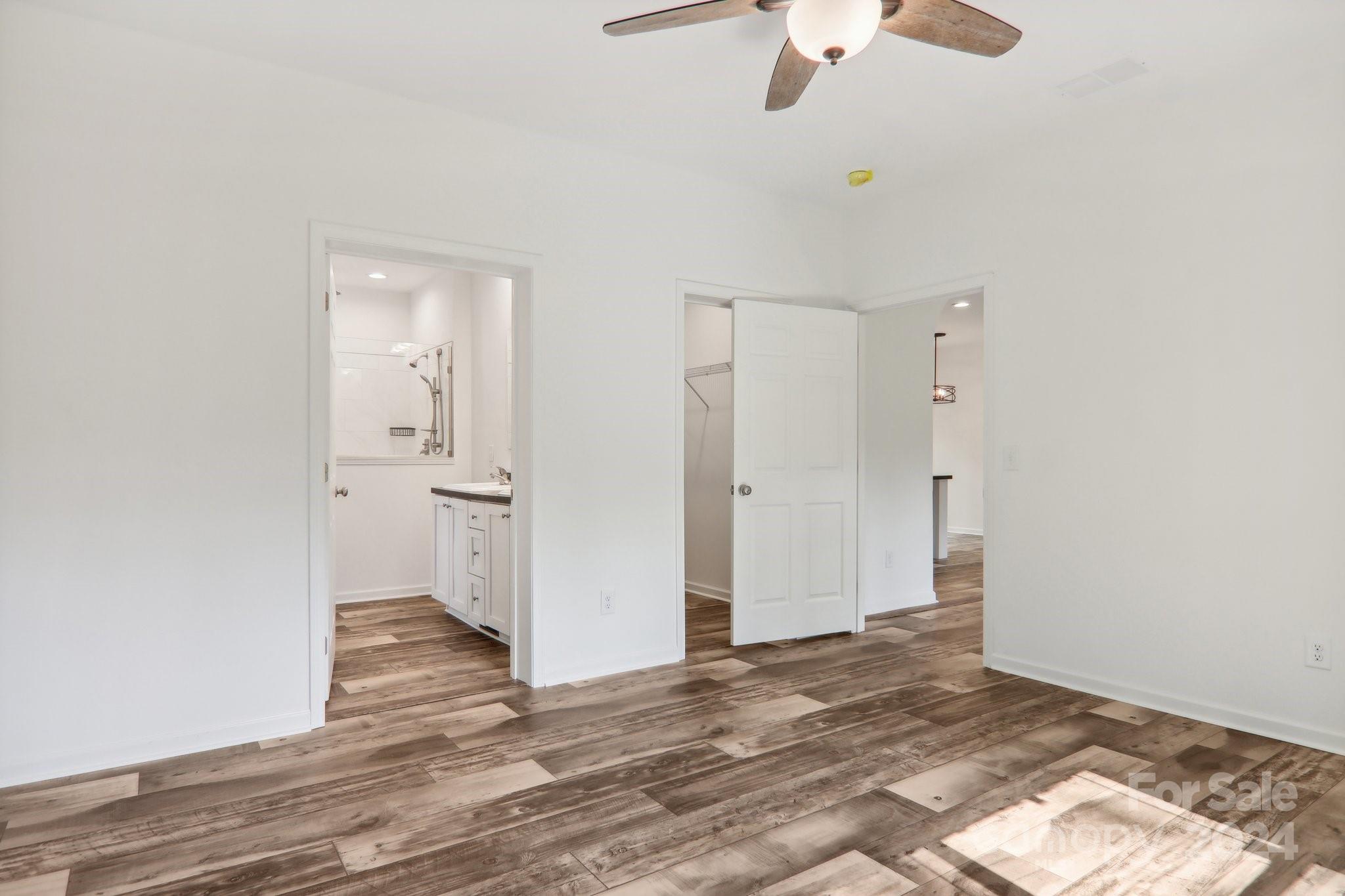 1730 Windswept Ridge Road Marshall, NC 28753 - Photo 21 of 45 a view of a room with a stylish ceiling fan and entryway