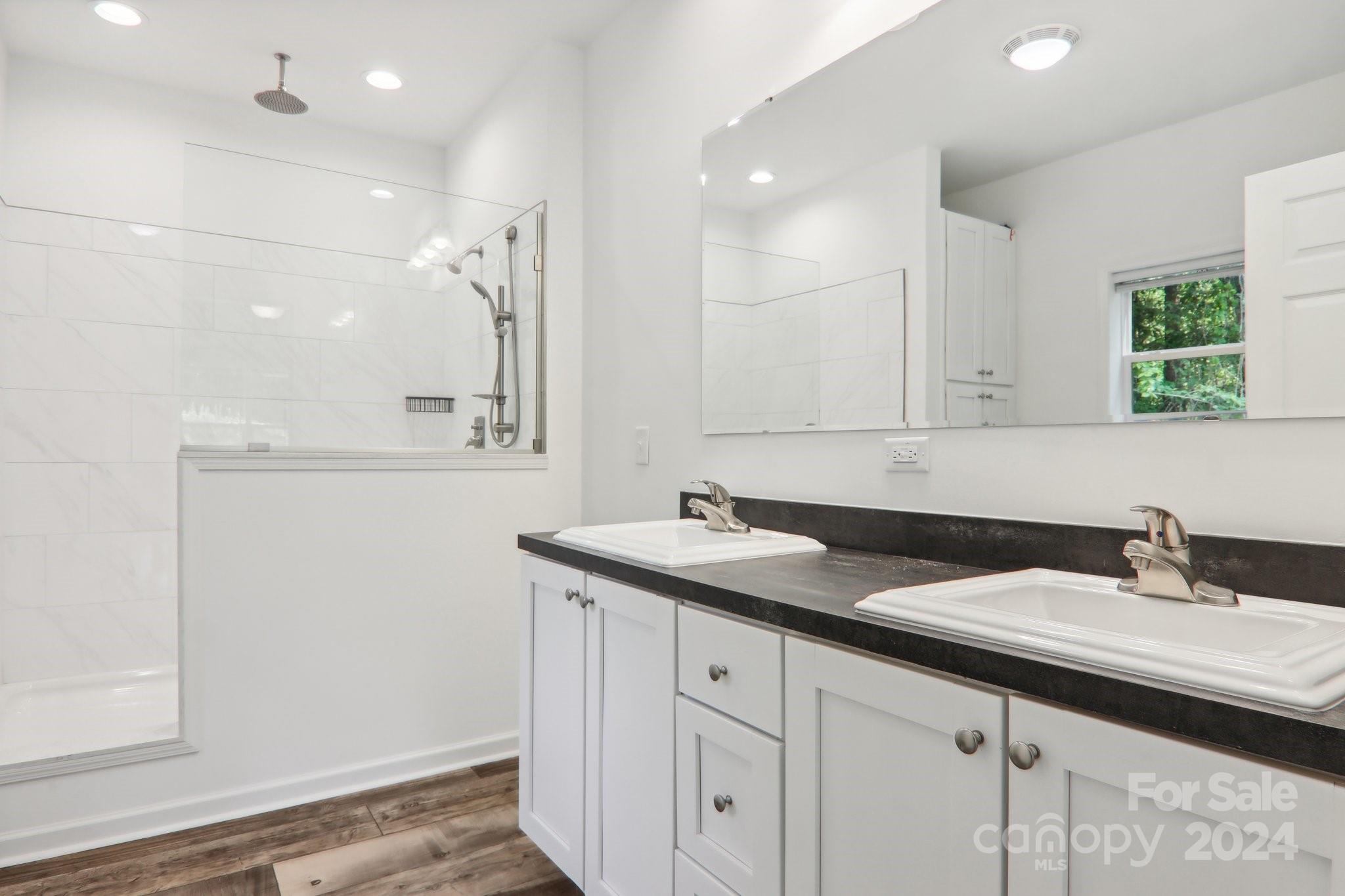1730 Windswept Ridge Road Marshall, NC 28753 - Photo 23 of 45 a bathroom with a sink and a mirror