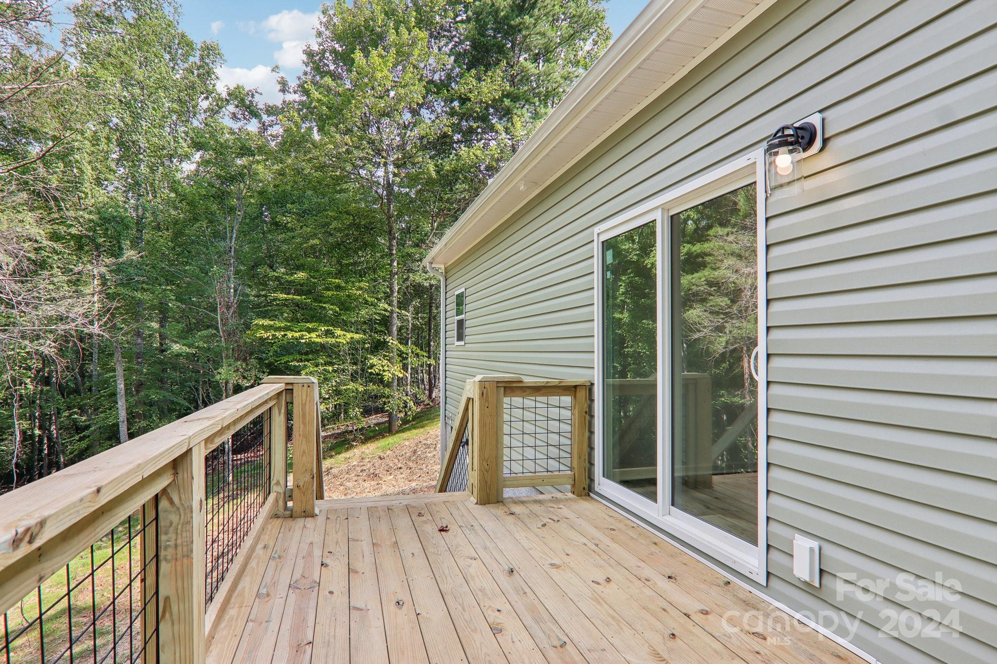 1730 Windswept Ridge Road Marshall, NC 28753 - Photo 35 of 45 a view of deck with wooden floor and fence