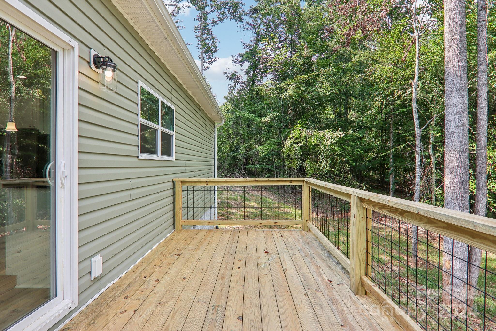 1730 Windswept Ridge Road Marshall, NC 28753 - Photo 36 of 45 a view of balcony with wooden floor and fence