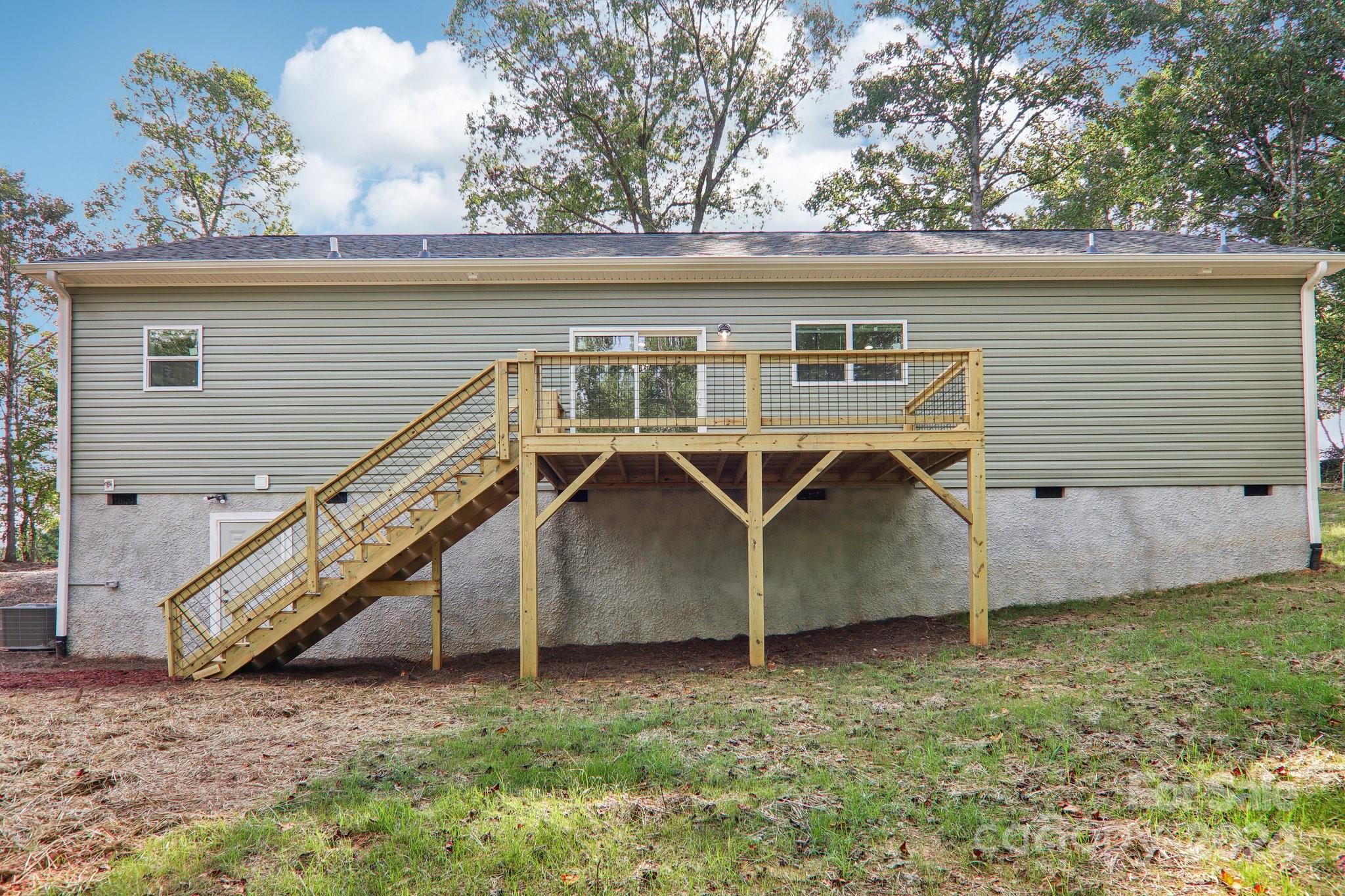 1730 Windswept Ridge Road Marshall, NC 28753 - Photo 38 of 45 a view of a house with a backyard