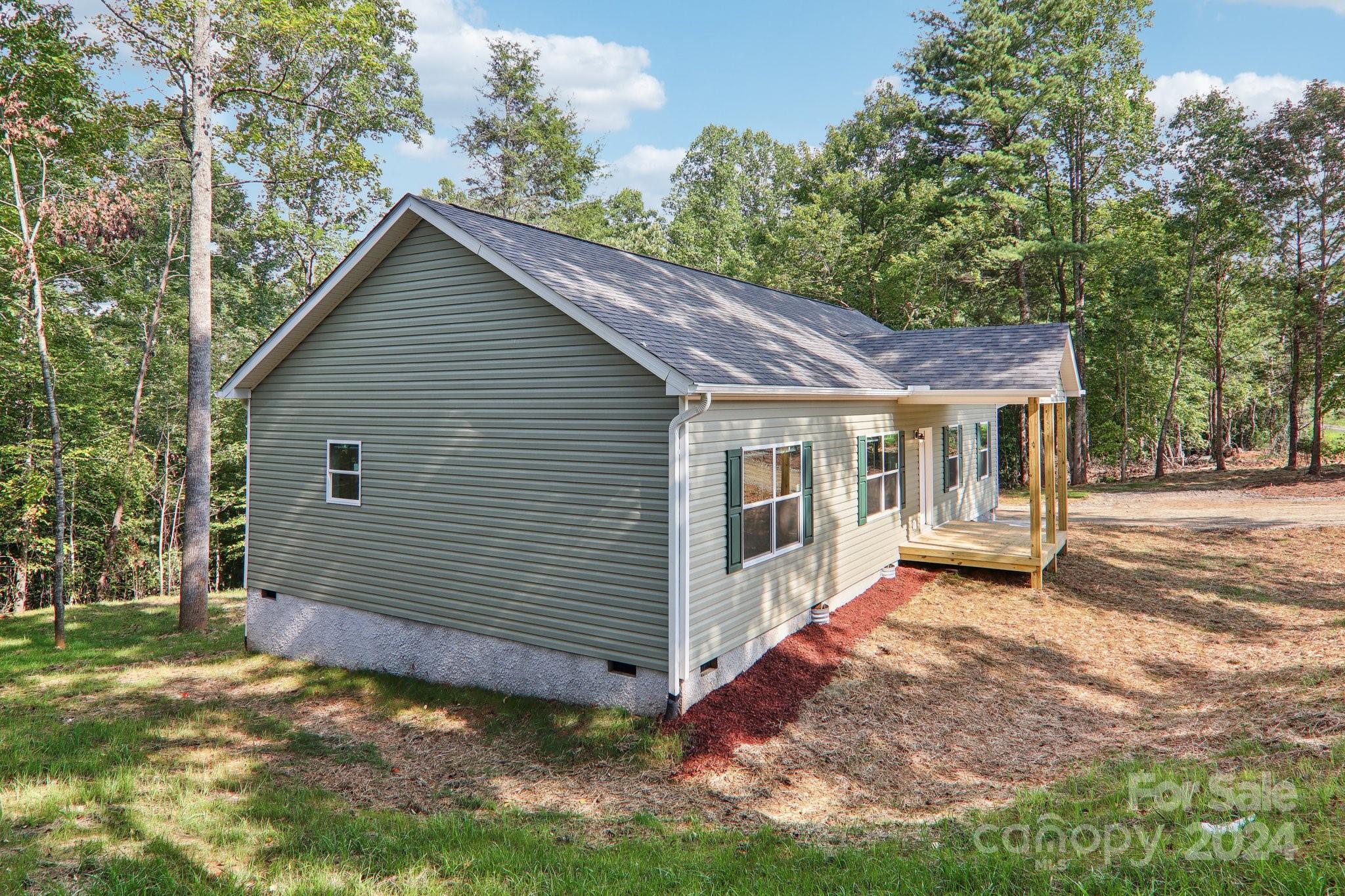 1730 Windswept Ridge Road Marshall, NC 28753 - Photo 5 of 45 a view of a house with a yard