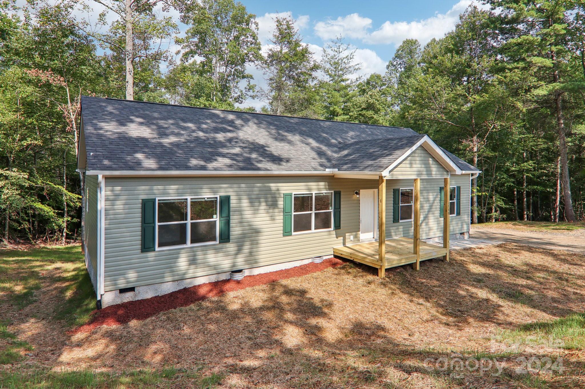 1730 Windswept Ridge Road Marshall, NC 28753 - Photo 6 of 45 a house view with a garden space