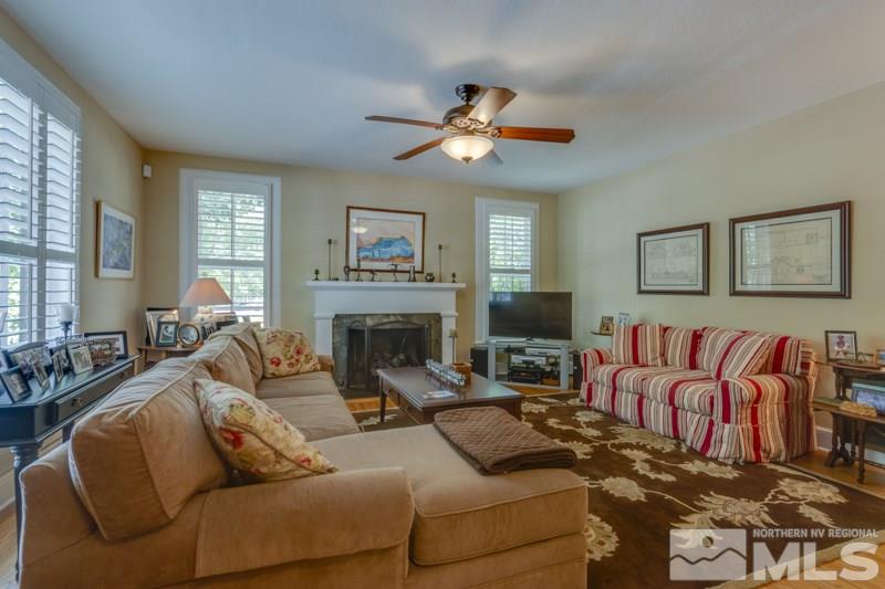 600 Gordon Avenue Reno, NV 89509 - Photo 5 of 25 a living room with furniture a fireplace and a large window
