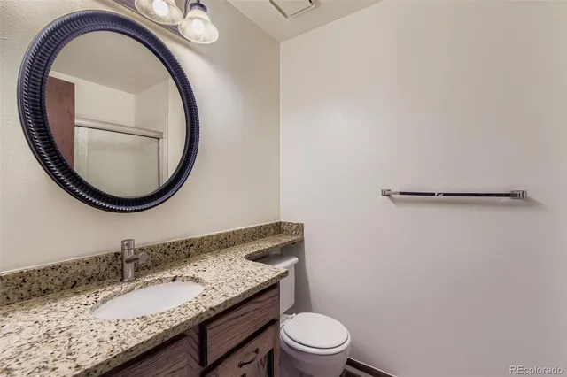 a view of a yard with wooden fence