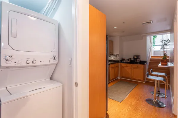 a view of kitchen with furniture and wooden floor