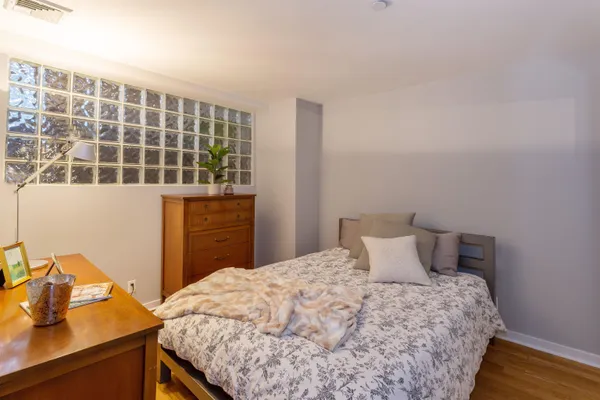 a bedroom with a bed and a window