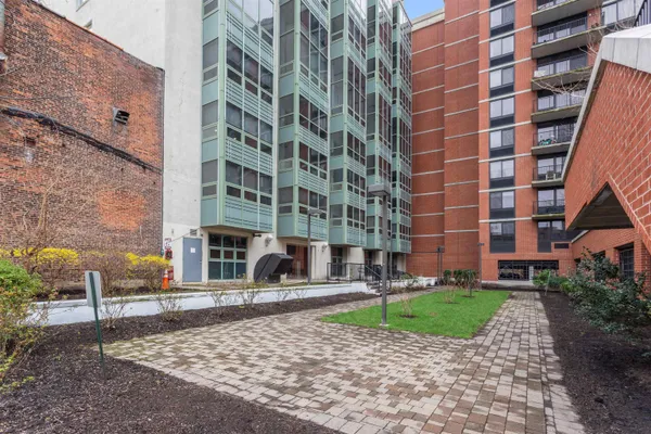 a view of a building with a yard